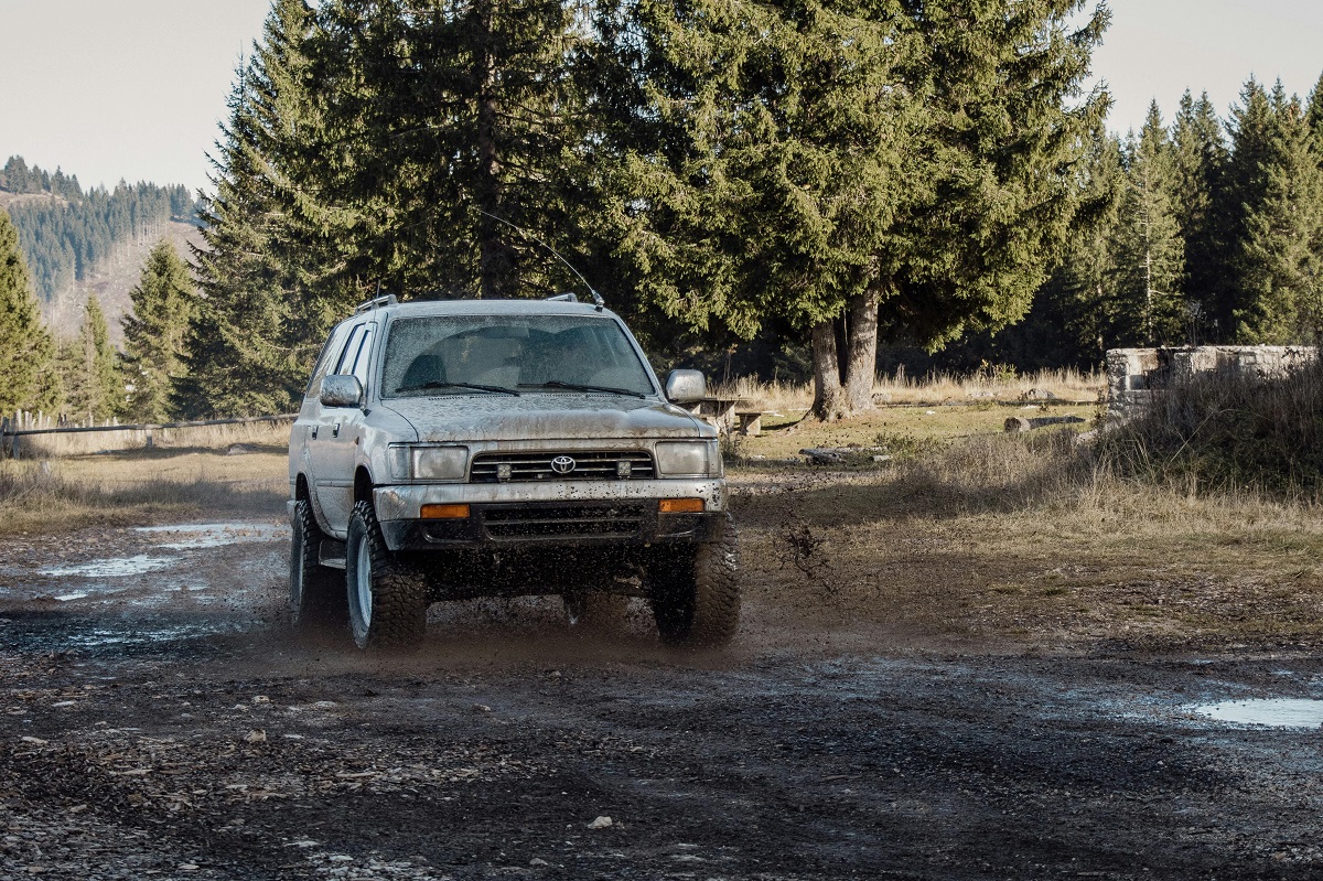 off-road SUV running on puddles